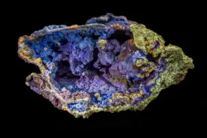 Spectacular fragment of multicolored mineral with lumpy shapes inside.