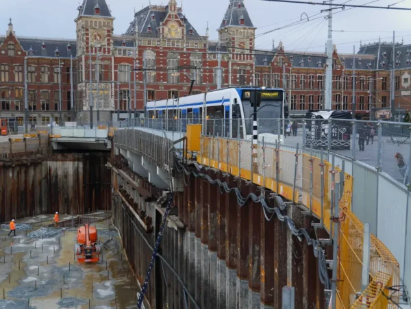 Risky deep foundation work near a historic building in a city.
